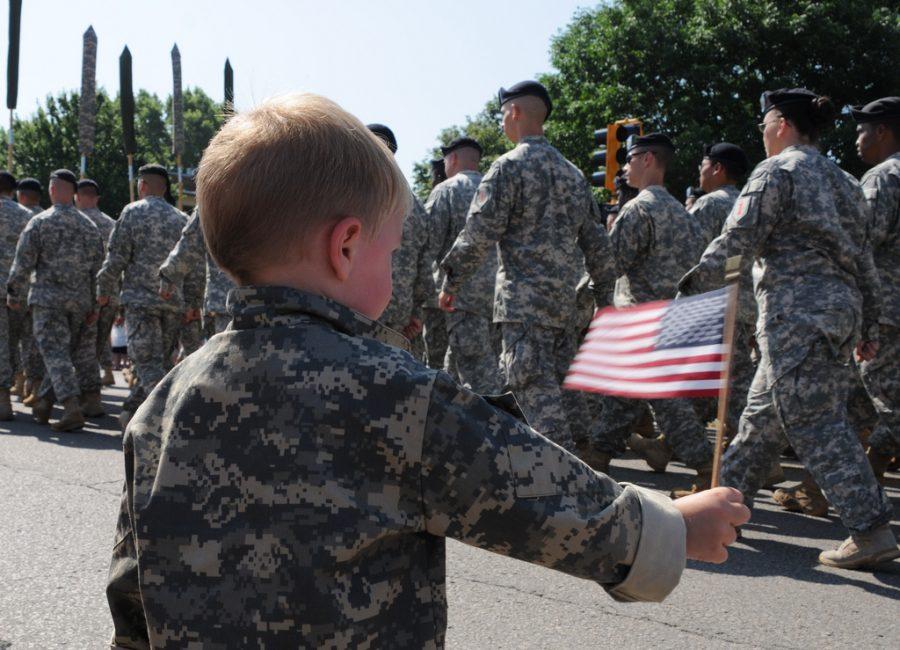 A soldiers child at a parade