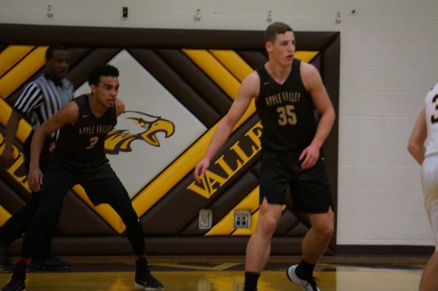 Tre Jones and Spencer Rolland on defense against Prior Lake.