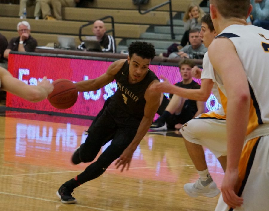 Tre Jones drives inside during the first quarter against Prior Lake.