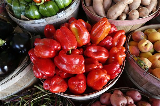 Freshly picked farm grown bell peppers are ready to be chosen by customers at Brenda's Produce stand in Jackson, Miss., Tuesday, July 14, 2015. A recent survey indicates Mississippi adults are last in eating vegetables but they are not alone. Most U.S. adults still aren't eating nearly enough fruits and vegetables with only 13 percent saying they eat the required amount of fruit each day and only 9 percent eating enough vegetables. (AP Photo/Rogelio V. Solis)