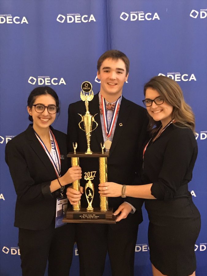 Tayla Rawdah, Ford Dreidel, and Carleen Olson proudly displaying their Marketing Plan-Services trophy 