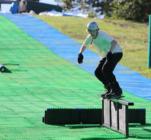 Snowboarder trying out Buck Hill's new Neveplast all-year sking technology