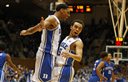 Duke's Jahlil Okafor (15) celebrates with teammate Tyus Jones (5) during the second half of an NCAA college basketball game against Presbyterian in Durham, N.C., Friday, Nov. 14, 2014. Okafor had 19 points and Jones added 15 in Duke's 113-44 win. (AP Photo/Karl B DeBlaker)