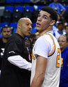 FILE - In this Saturday, March 4, 2017, file photo, UCLA guard Lonzo Ball, right, walks away after hugging his father, LaVar, following the team's NCAA college basketball game against Washington State in Los Angeles. The UCLA freshman point guard has been one of college basketball's best players and could be the No. 1 pick in the NBA draft. He's kept up his high-level of play over the past month as his father, LaVar, has become more vocal in the media.  (AP Photo/Mark J. Terrill)