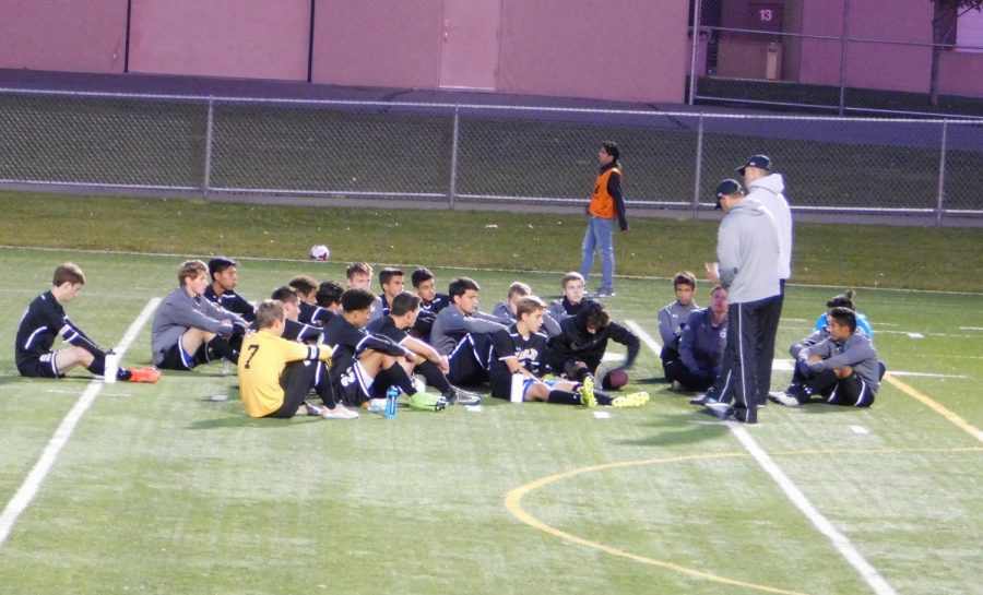 The boys gather for words of wisdom of the coaches.