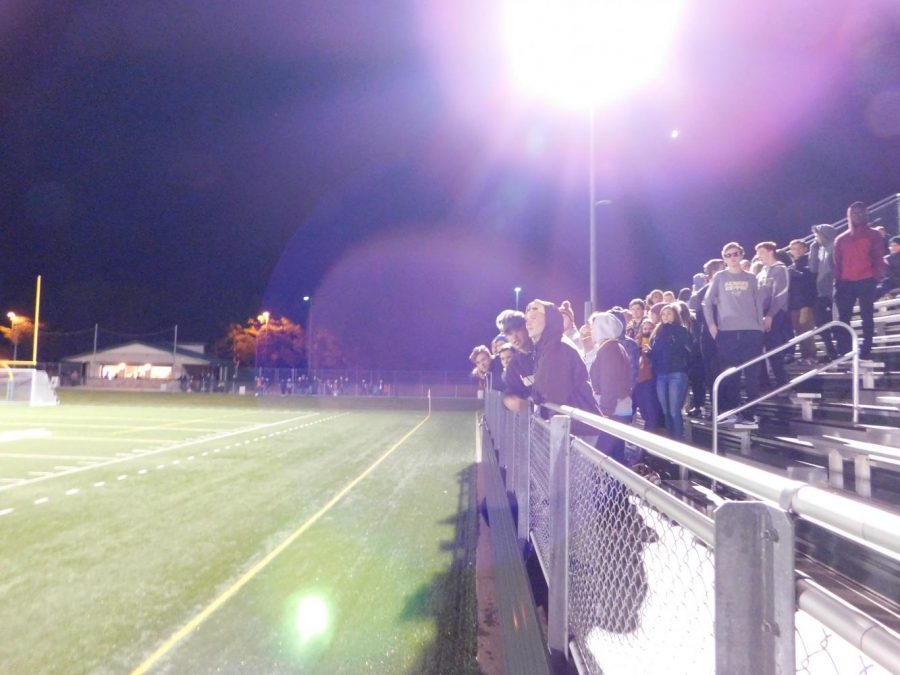 Many fans stayed after the sun set to support the team.