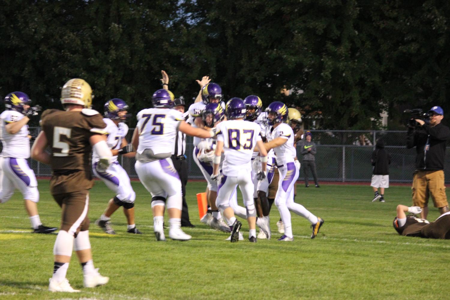 Chaska celebrates its first touchdown in a win over Apple Valley in AVHS' homecoming game.