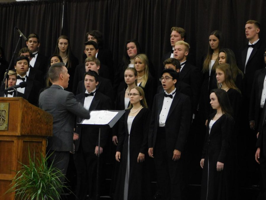 Joel Beyer directs VSC in the performance of "Sure on This Shining Night."