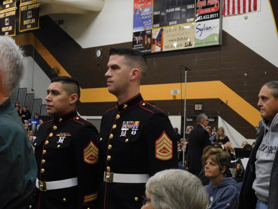 Veterans stand as they hear their theme song from the "Armed Forces Salute," performed by the AVHS Wind Ensemble.