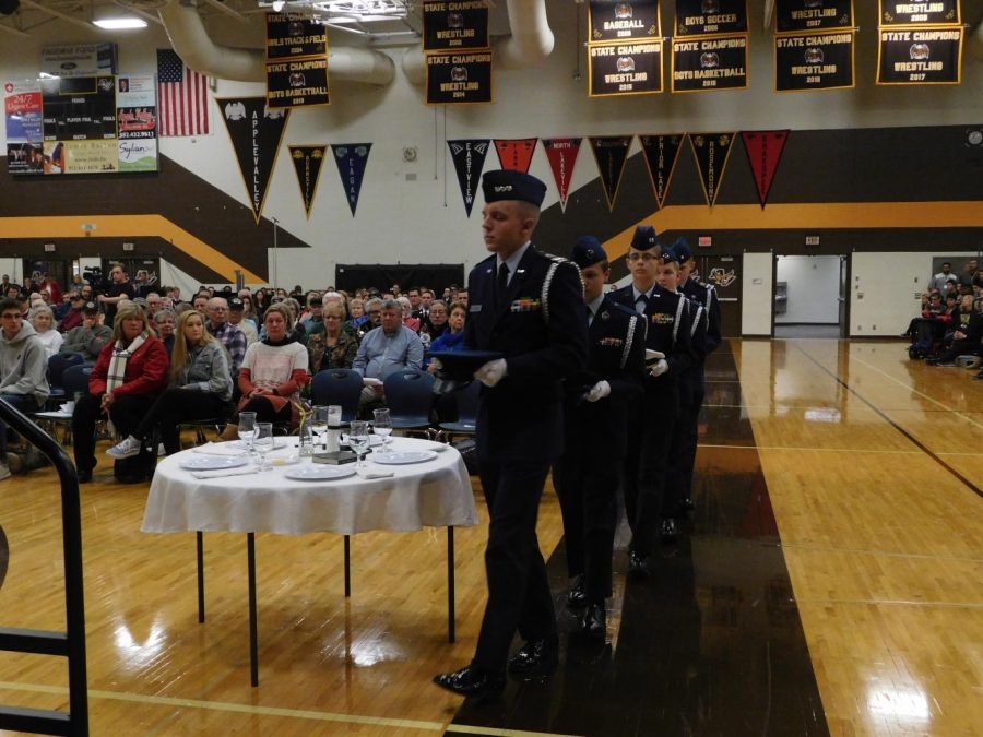 Members of JROTC perform the Table of Remembrance ceremony.