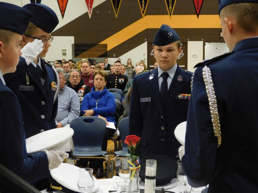 Members of JROTC perform the Table of Remembrance ceremony.