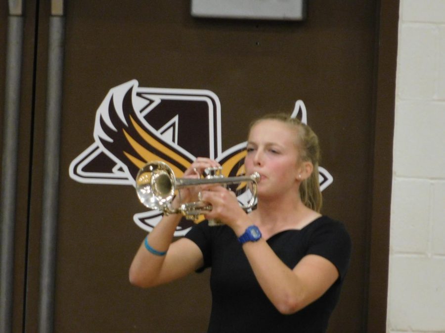 AVHS Senior Molly Moynihan performs Taps on trumpet.