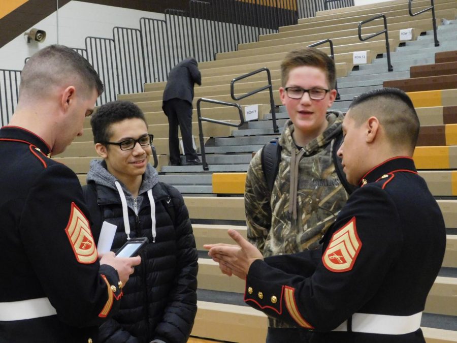 AVHS students talking with members of the armed forces.