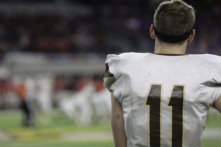 Senior wide receiver Luke Martens watches from the sidelines.