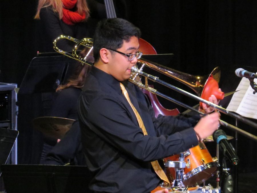 Kenan Lumantas solos on the trombone at a Jazz Ensemble Concert.