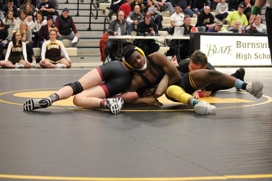 Senior Martin Stewart controls Simon Kajer of New Prague in a semifinal dual.