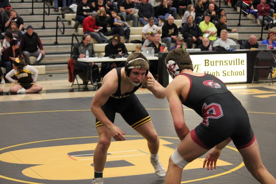 Senior Michael Mattison in the opening stages of the 182-pound match against New Prague